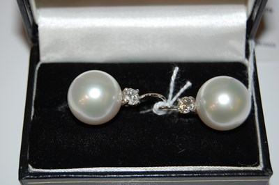 Lot 46 - A pair of Art Deco style white metal, pearl...