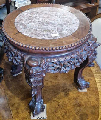 Lot 779 - A Chinese darkwood jardiniere stand, the...