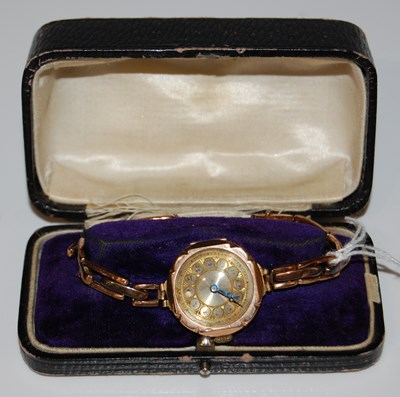 Lot 50 - A 9ct gold cased ladies wristwatch with engine-...