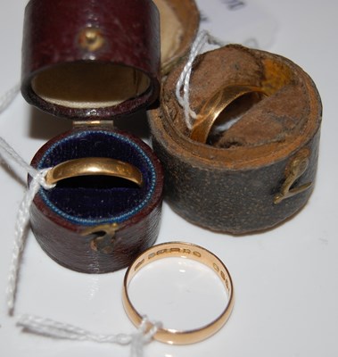 Lot 52 - Three assorted yellow metal rings.