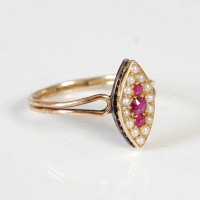 Lot 54 - A yellow metal, synthetic ruby and split pearl...