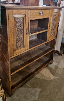 Lot 940 - A late Victorian oak side cabinet fitted with...