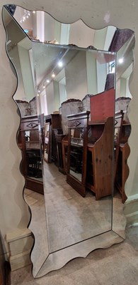 Lot 855 - A contemporary rectangular wall mirror, the...