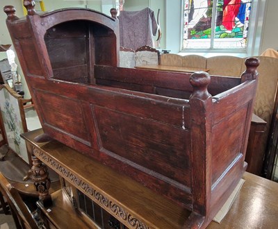 Lot 949 - An antique stained pine crib, 91cm long x 64cm...