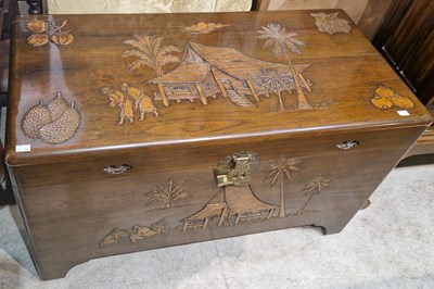 Lot 957 - A Chinese carved wood blanket box, decorated...