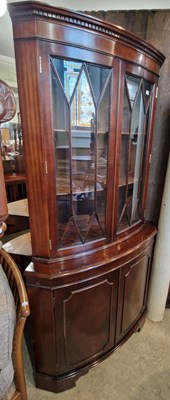 Lot 815 - A reproduction mahogany bow front corner...