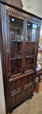 Lot 816 - A stained oak corner cupboard.