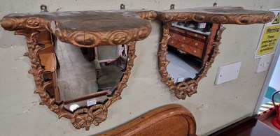 Lot 860 - A pair of giltwood wall brackets with mirrored...