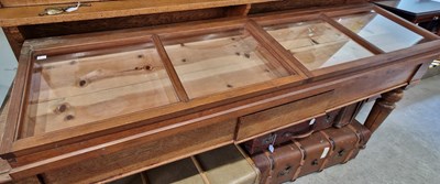 Lot 828 - A pine table top display cabinet fitted with...