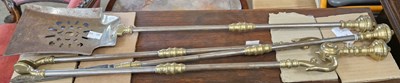 Lot 844 - A set of three steel and brass fire irons,...