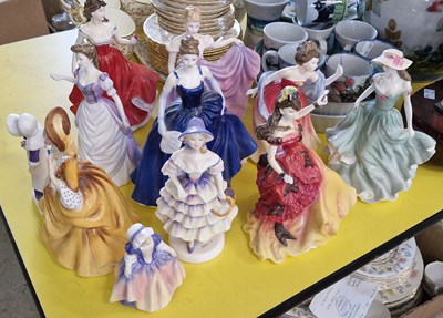 Lot 567 - A collection of eleven Royal Doulton lady...