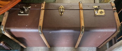 Lot 904 - A vintage brown coloured cabin trunk with wood...