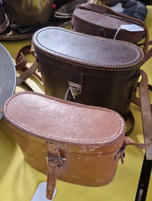 Lot 373 - Three assorted leather binocular cases, to...