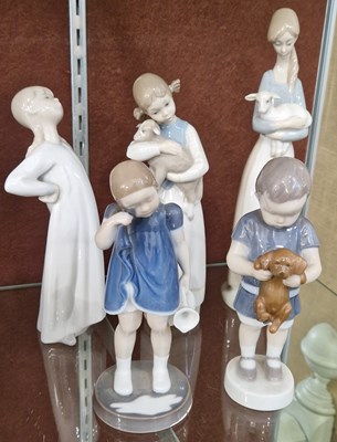 Lot 6 - A collection of five ceramic figures to...