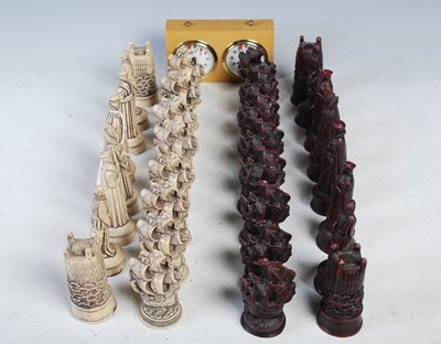 Lot 269 - A complete set of resin chess pieces together...