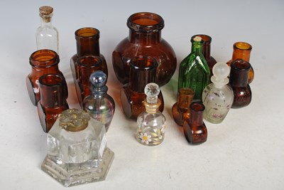 Lot 270 - A box of assorted glass bottles and storage...