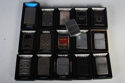 Lot 282 - A group of fifteen boxed Zippo lighters and...