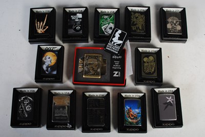 Lot 284 - A group of thirteen boxed Zippo lighters and...