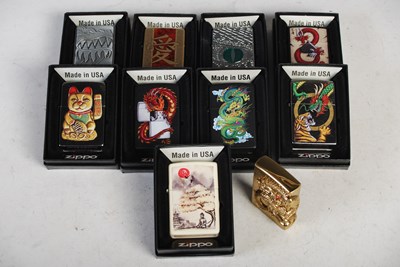 Lot 288 - A group of nine boxed Zippo lighters and one...