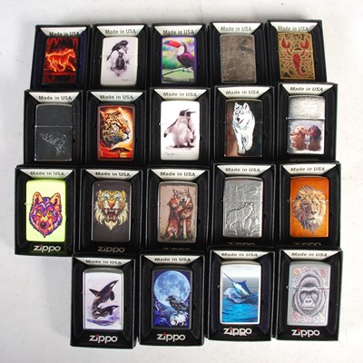 Lot 289 - A group of nineteen boxed Zippo lighters, all...