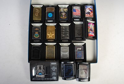 Lot 295 - A group of seventeen boxed Zippo lighters,...