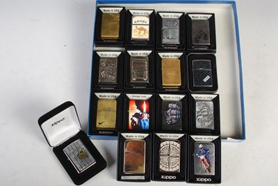 Lot 298 - A group of sixteen boxed Zippo lighters, to...