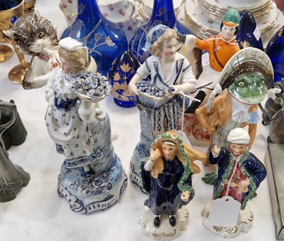 Lot 337 - A group of seven porcelain and ceramic figure...