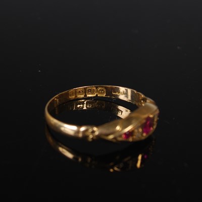 Lot 30 - An 18ct gold ruby and diamond chip ring, size '...