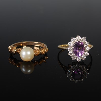 Lot 36 - A 9ct gold and pearl set ring, size 'O', gross...