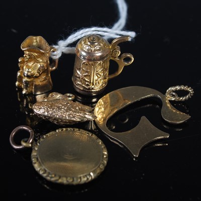 Lot 35 - Four assorted 9ct gold charms to include Toby...