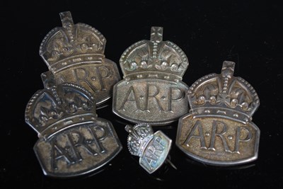 Lot 58 - Five assorted vintage white metal A.R.P badges.