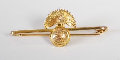 Lot 76 - A yellow metal regimental brooch for the...