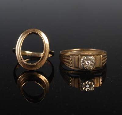 Lot 83 - Two 9ct gold rings, one set with a small...