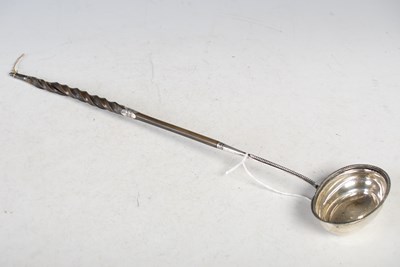 Lot 130 - An antique London silver toddy ladle with...