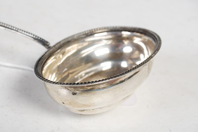 Lot 130 - An antique London silver toddy ladle with...
