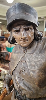 Lot 401 - A bronzed terracotta figural table lamp in the...