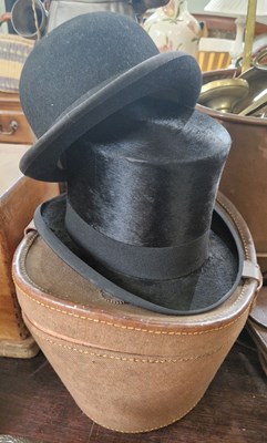 Lot 406 - A canvas and leather cased top hat, London...