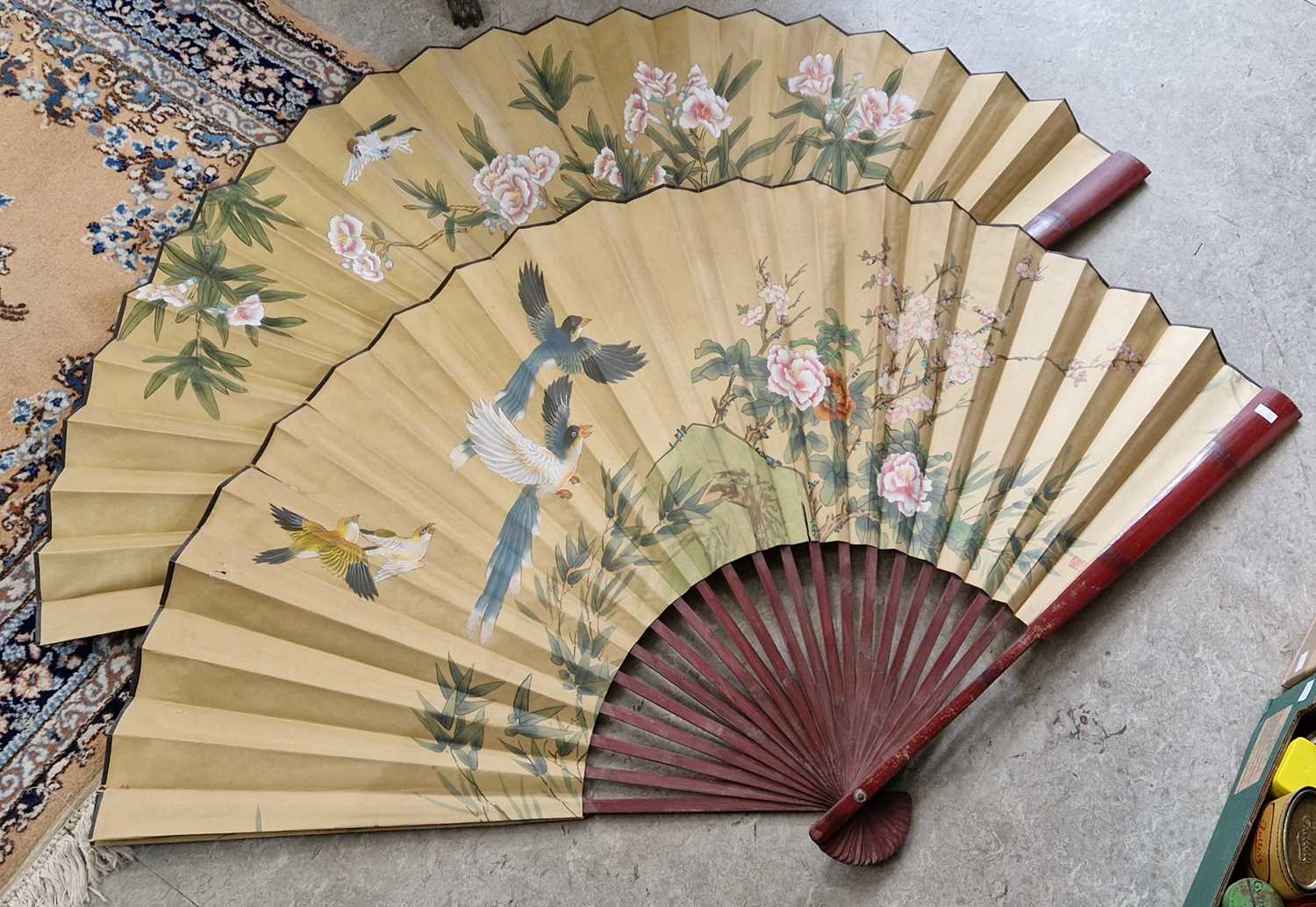 Lot 413 - Two large Japanese lacquered wall fans,...