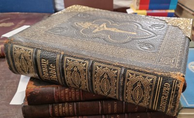 Lot 450 - A leather and brass bound family Bible,...