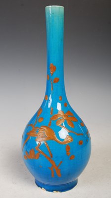 Lot 23 - A Japanese blue ground pottery bottle vase...