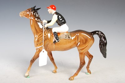Lot 168 - A Beswick model of a jockey and racehorse,...