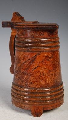 Lot 239 - A Swedish fruit wood lidded tankard with...